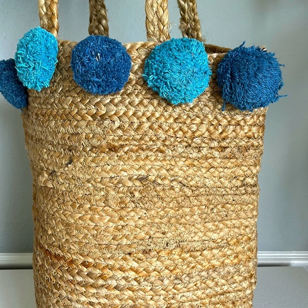 - Anthropologie Jute Braided Tote bag with  Pom Pom
